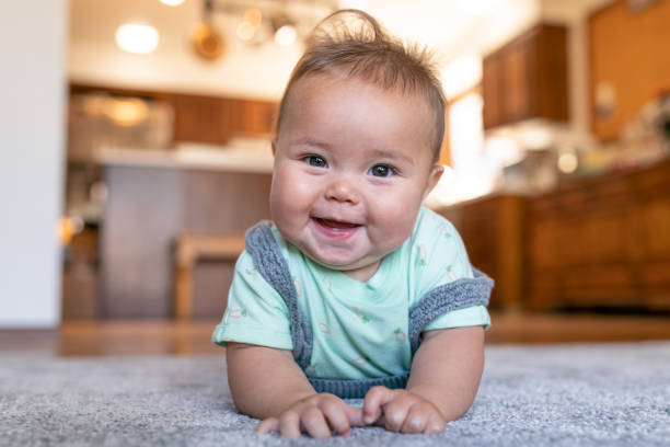 Baby laying on carpet floorings | Dary Carpet & Floors